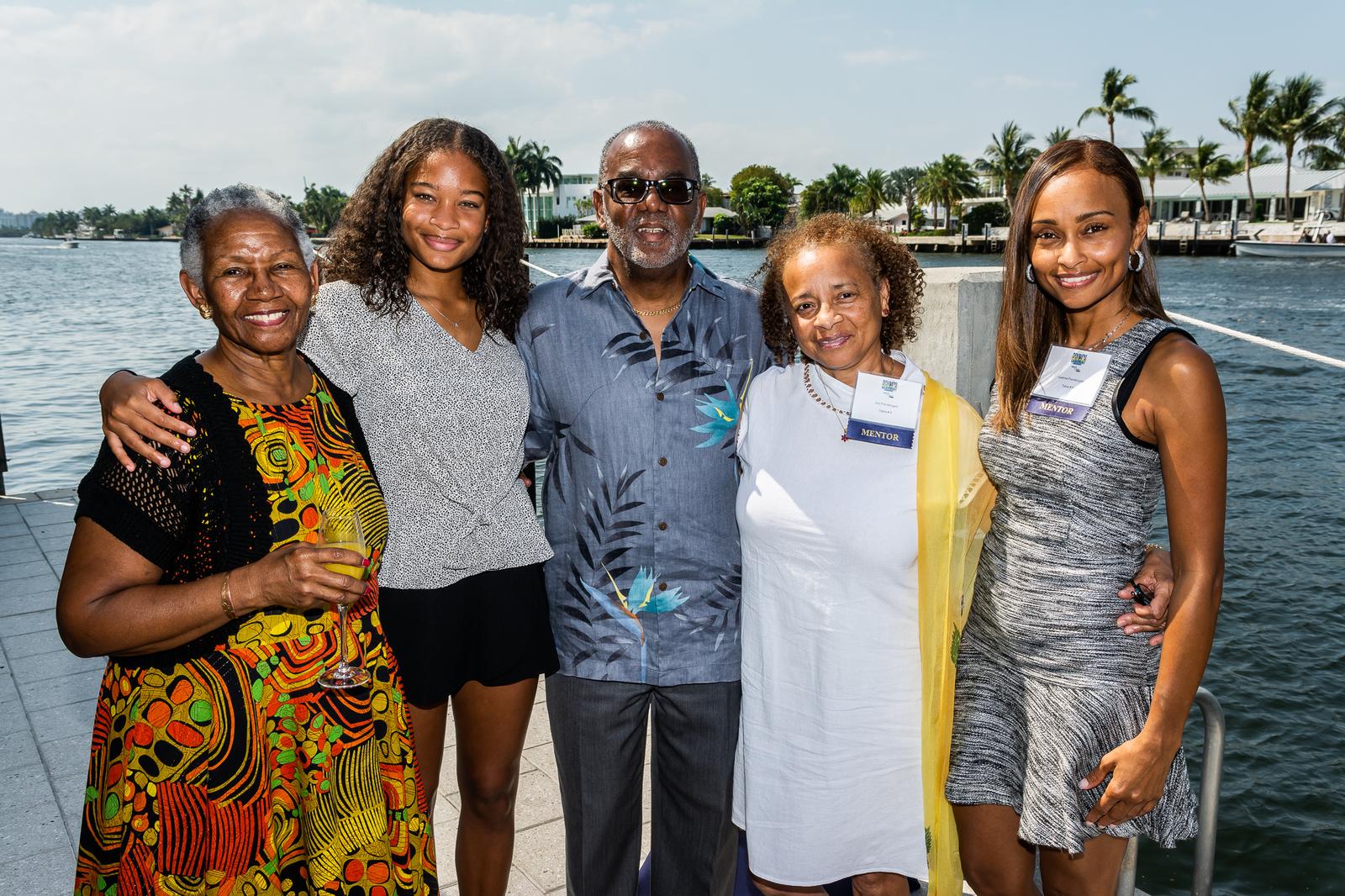 A group of supporters together at a waterfront Take Stock in Children event