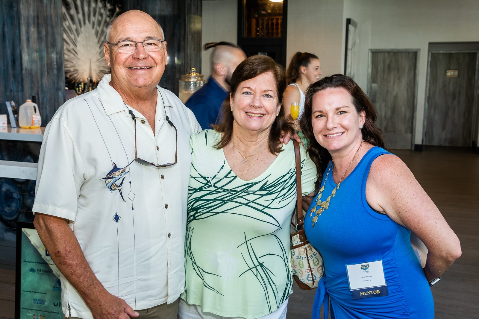 Three guests together at a Take Stock in Children of Broward reception