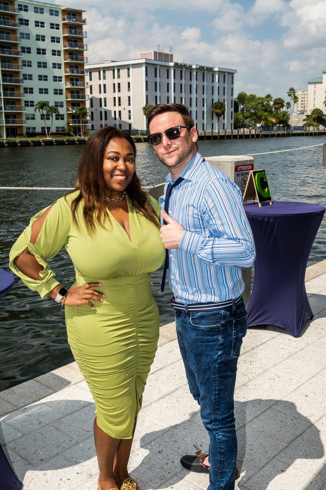 Two guests on the waterfront at a Take Stock in Children fundraiser