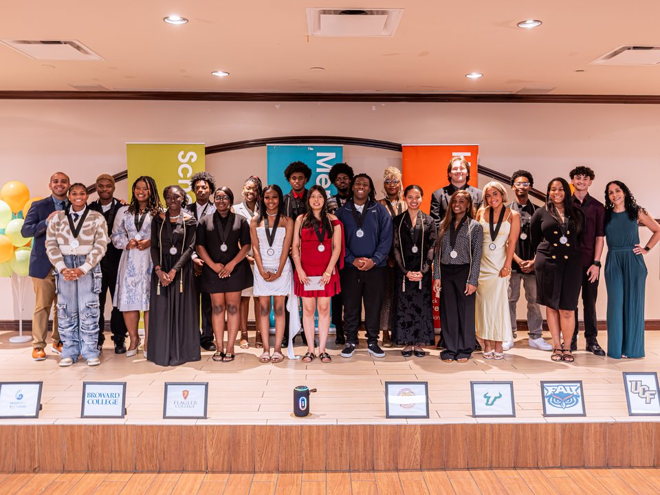Take Stock in Children Broward Class of 2026 scholars celebrating graduation and post-secondary opportunities on stage