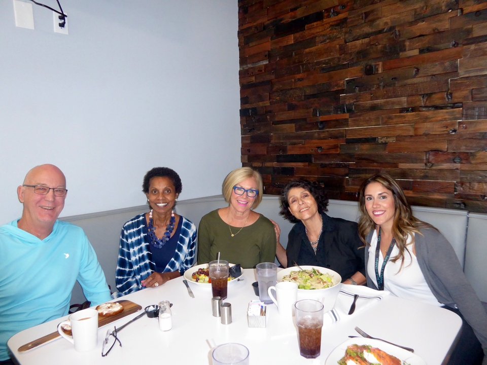 Take Stock in Children volunteer mentors gathering for a community meeting