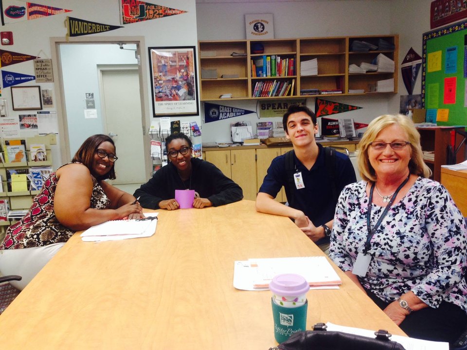 Scholars and mentors collaborating in a college-readiness center